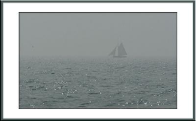 On the way out we see pleasure boats on the horizon...far away through the fog.
