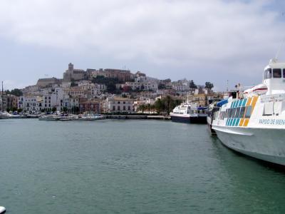 Unmistakable Ibiza town with Formentera ferries idle at the port