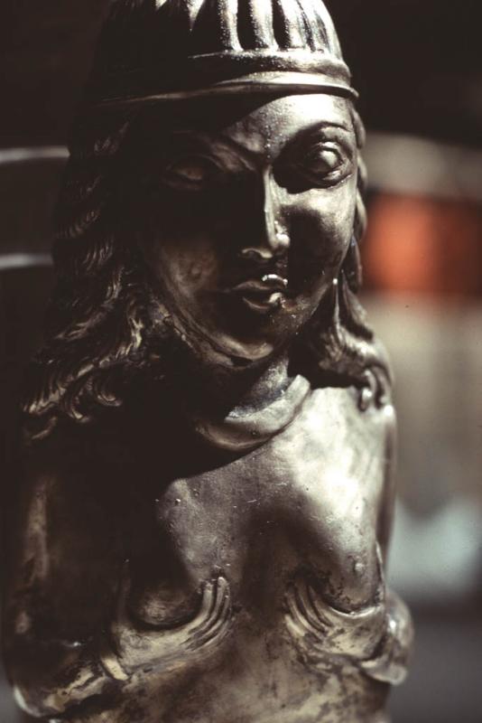 Silver woman figurine