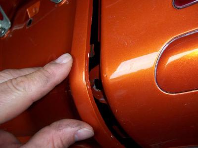 Be careful to line up the holes and tabs properly when reinstalling the rear fender panel