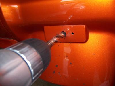 Now I drilled out the existing hole, so it would be large enough that I could get my Dremel tool in it.