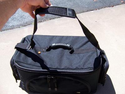 A shoulder strap is also provided with the bag.  Empty bag weighs 7 lbs.