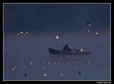 fisherman in the morning mist