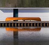 Canoe Beside Boathouse