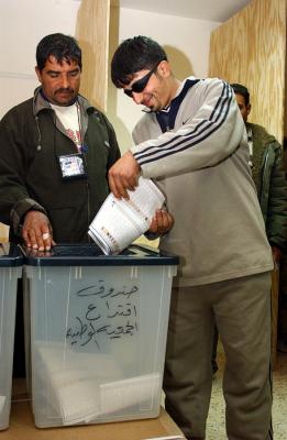 happily dropping ballot in the box