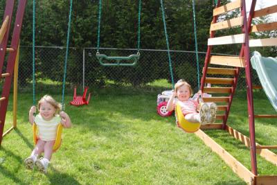 Enjoying our new swings (Reagan on left)