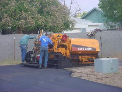 paver and workers
