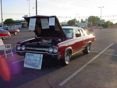 red Oldsmobile with 2 stars