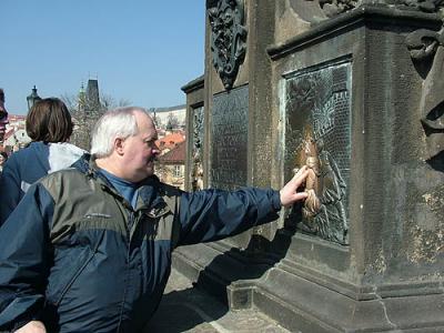 Touching the statue for good luck!