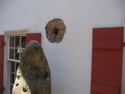 canon ball holes in the side of the houses