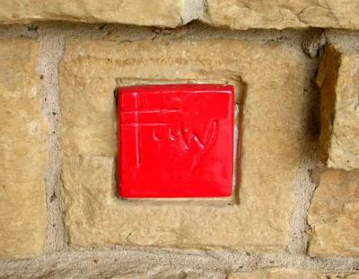 FLW initials in stone by front door