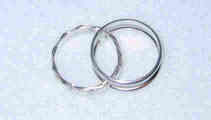 The Brenda ring consists of 2 stationary rings (joined) and a central loose ring that moves.