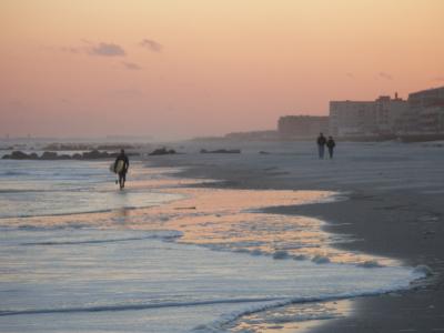 Surfer and Strollers and Sunset