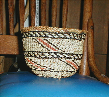 Basket with beargrass decoration. Raffia over cedar bark.