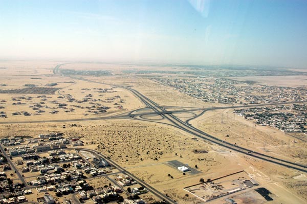 Emirates Road E-11 with Mirdif, left and Ar-Rashidya, right