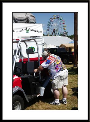 Farm implements and transportation attract fair-goers.