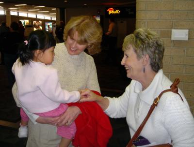 Kathie Greets Alexis and M-B at the Airport