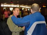 Steve Greets Mike at the Airport