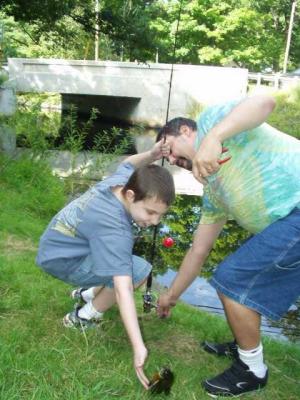 Michael lands his first fish