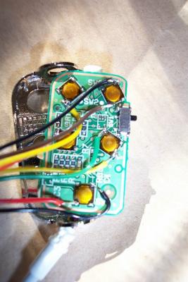 Here is a view of the circuit card for the remote with my wires tacked on