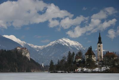 Lake Bled with Bled Castle on left Parish Church of St Martin in centre and Bled Island on right