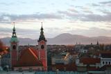 sunset over Ljubljana with mountains in the background