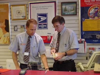 co-worker and Dave  working together USPS