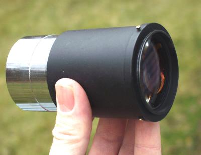 This shot shows the 49mm threaded ring which attaches to the eyepiece with set screws.
A seperate ring was used so that rings of other diameter could be utilized for different cameras.
The rubber eyeguard was removed and approximately 18mm of the eyepiece tube top was parted off with a lathe.
A circular groove was then cut on the outside edge to hold the set screws that were tapped into the adapter ring.