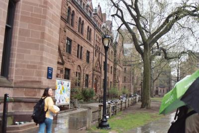 Yale student passes by colorful outdoor billboard!