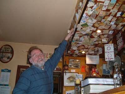 Stephen putting his and Joan's card up in the pub!