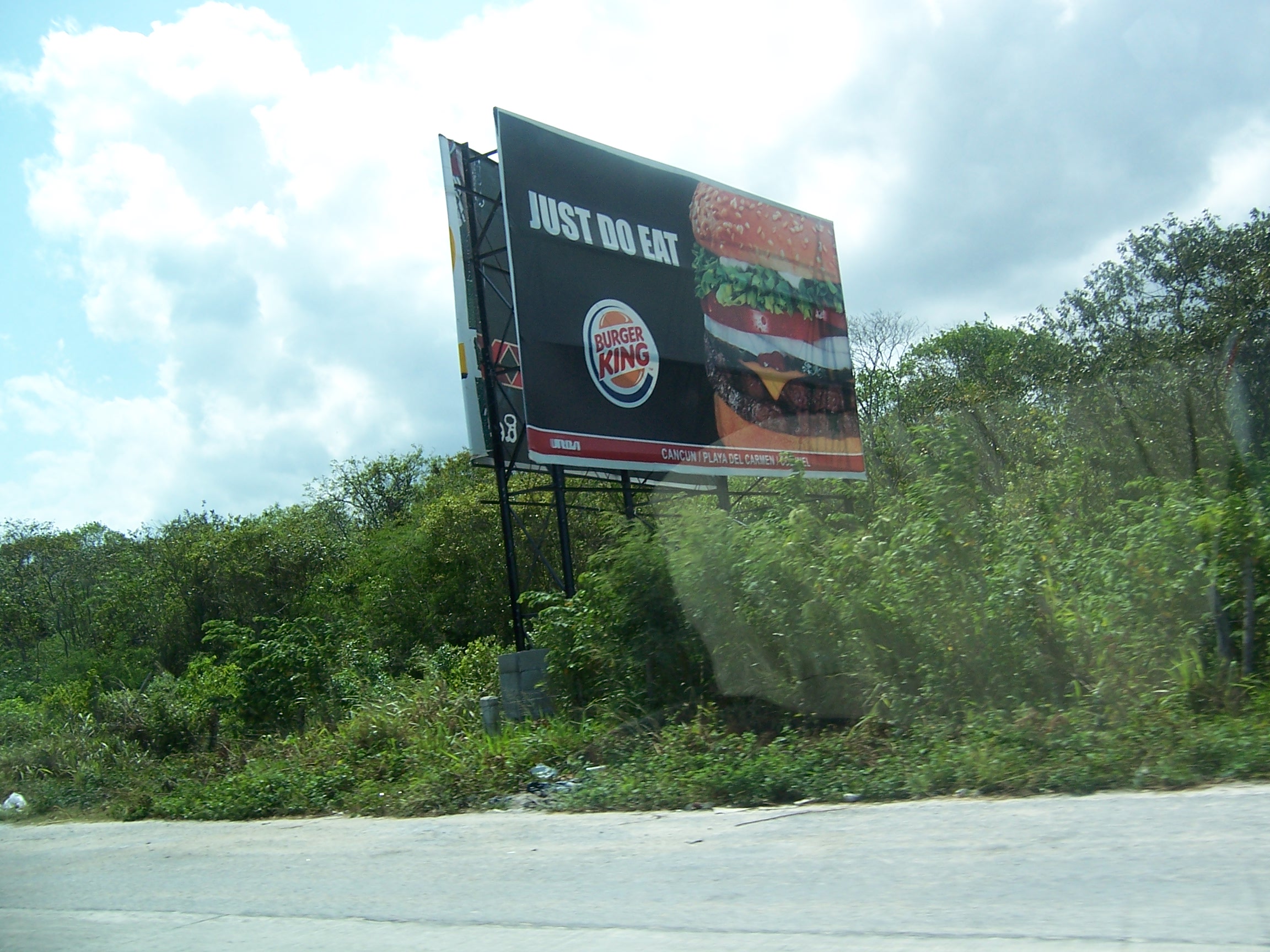 Billboard just outside of Cancun. Its hard to feel like youre in Mexico when the billboards are all in English.