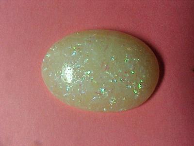 This opal was created using Kato Sauce (and a secret ingredient) inside a Miracle Mold i made from a cabochon.