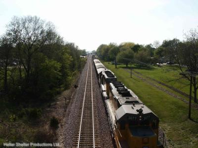 Engines of work train delivering ballast and track sections.jpg