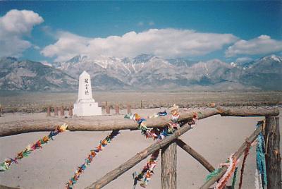 Although 143 internees died at Manzanar, only 15 are buried in this cemetery.  The others were buried in their hometowns. Note: the origami paper cranes on the fence and the memorial in the distance.