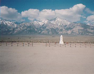 The cemetery is in the back, and many people do not realize it is even there.  This panoramic view gives you an idea of the landscape.  The snow is still on the surrounding mountains, even though this photo was taken in May.