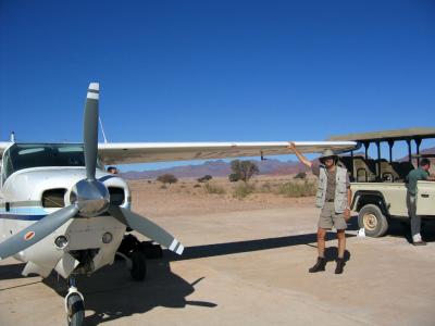 Landing in the Namib (notice Jim's full airsickness bag near the jeep)