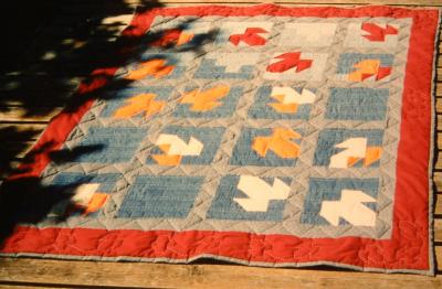 Fall quilt on summer deck