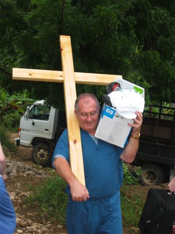 Bill carries the cross