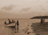 Fishermen coming in at Playa de Manglito.jpg