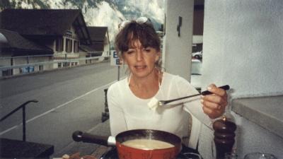 Judy eating fondue dinner in Lauterbrunnen. Arrived in Lauterbrunnen via funicular after taking trail from Murren to Grutschalp