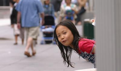 Little girl playing peek-a-boo