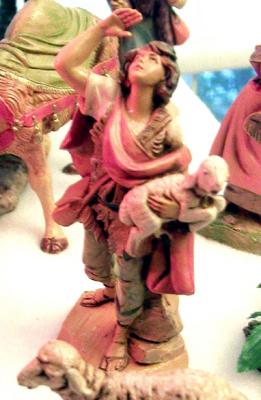 A shepherd (added this year) looks up at the angels.