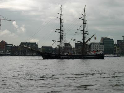 Amsterdam's skyline and a tall ship, seen from the northern side of the IJ river.