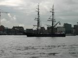 Amsterdams skyline and a tall ship, seen from the northern side of the IJ river.