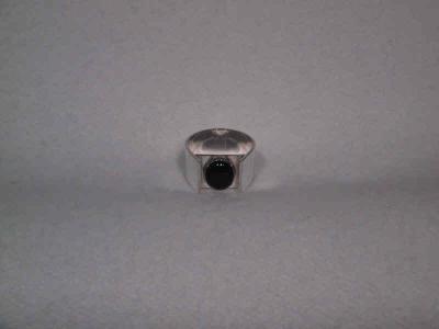 Large (8x10) cabochon onyx set in a horse-shoe style ring. The band is approx 12 mm wide.