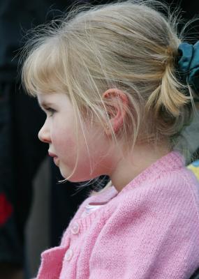 Little girl watching busker
