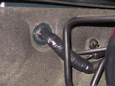 I had to split the grommet and then refeed my 4 gauge as well as the new fog lead.  All taped back up.