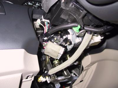 Steering column covers removed; note how I tied up the harness