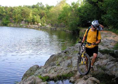 A cyclist arrives at the end of one of the towpath's  rocky sections