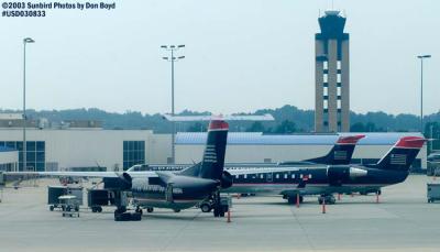 US Airways DHC-8-201 N965HA and CL-600-2B19 N27185 from US A320-214 N111US flight 1623 CLT-FLL aviation stock photo #6580